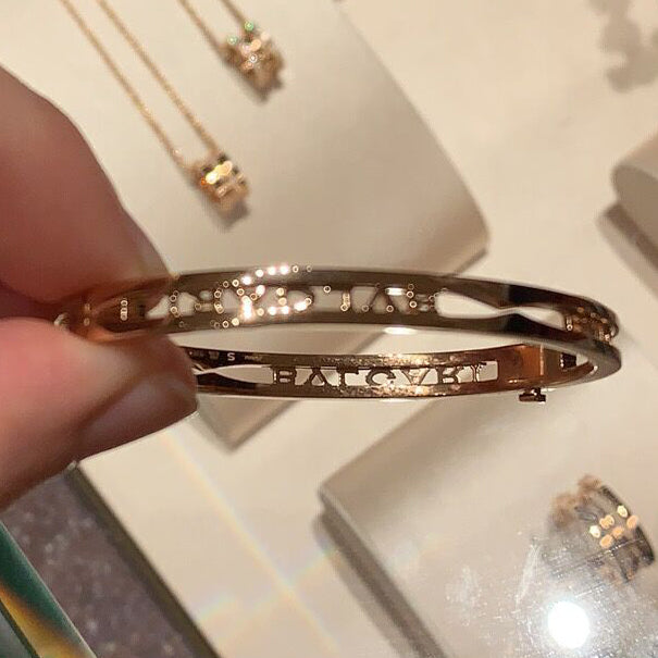 BGLBR858669 Baogai light gold hollow logo bracelet