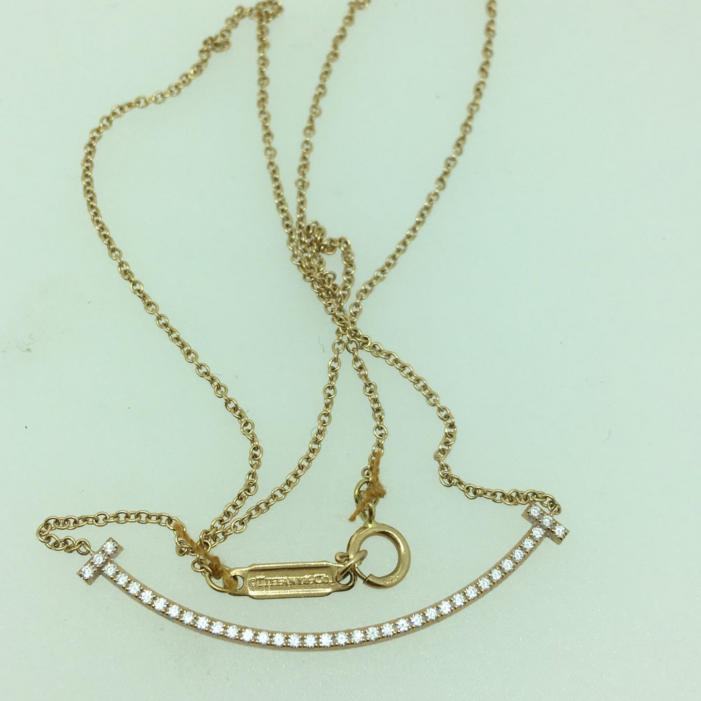 TIF89670281客版中号满钻虎爪微笑T字吊坠