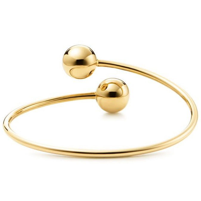 TIF5515378 large light gold ball-shaped wrap-around twisted arm open bracelet