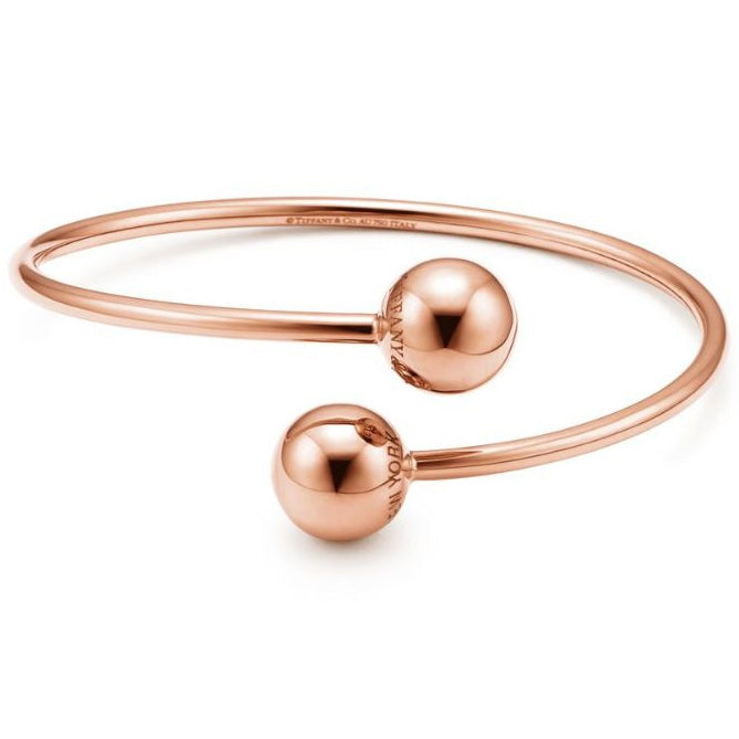 TIF5515378 large light gold ball-shaped wrap-around twisted arm open bracelet