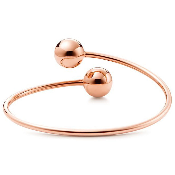TIF5515378 large light gold ball-shaped wrap-around twisted arm open bracelet
