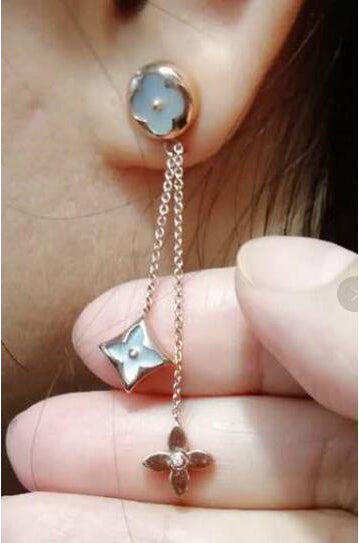 LV-Q53440 small plum blossom flying mark earrings