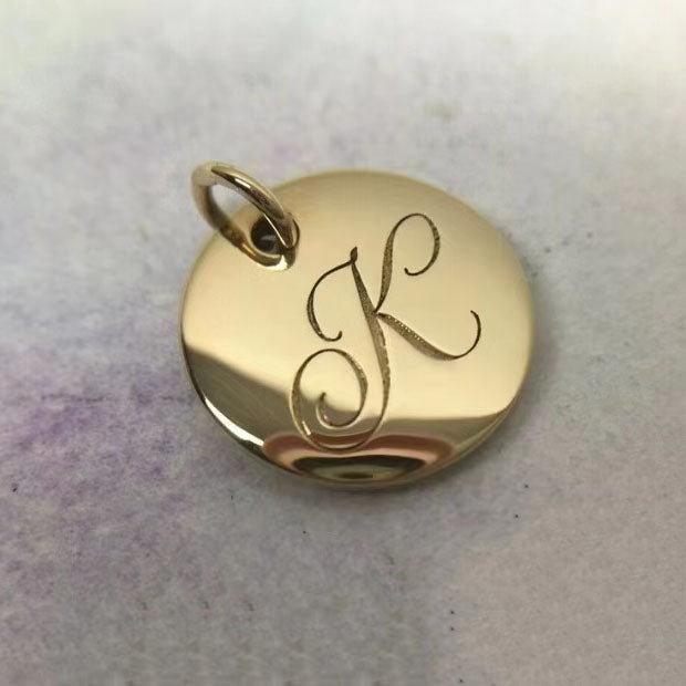 TIF26724100 light gold disc letter K pendant