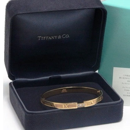 TIF79968301 Closed hinged three diamond Roman bracelet