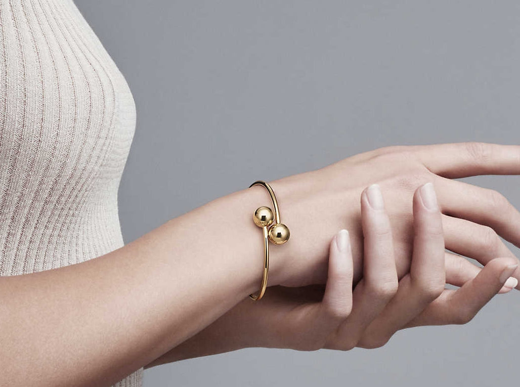 TIF5515378 large light gold ball-shaped wrap-around twisted arm open bracelet