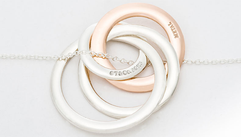 TIF89766447 light gold ring four-ring pendant