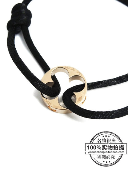 LV-Q95647路路通光金四叶草黑绳手链