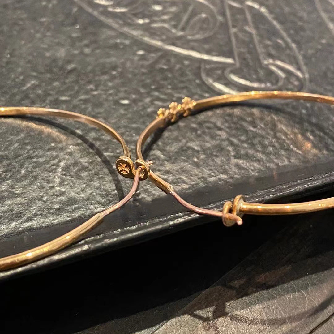 KLX-964244 light gold spear flower cross hoop earrings