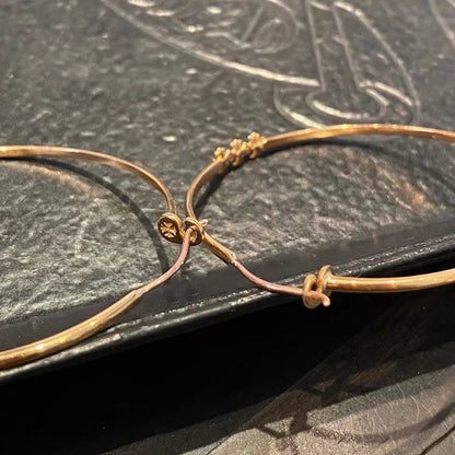 KLX-964244 light gold spear flower cross hoop earrings