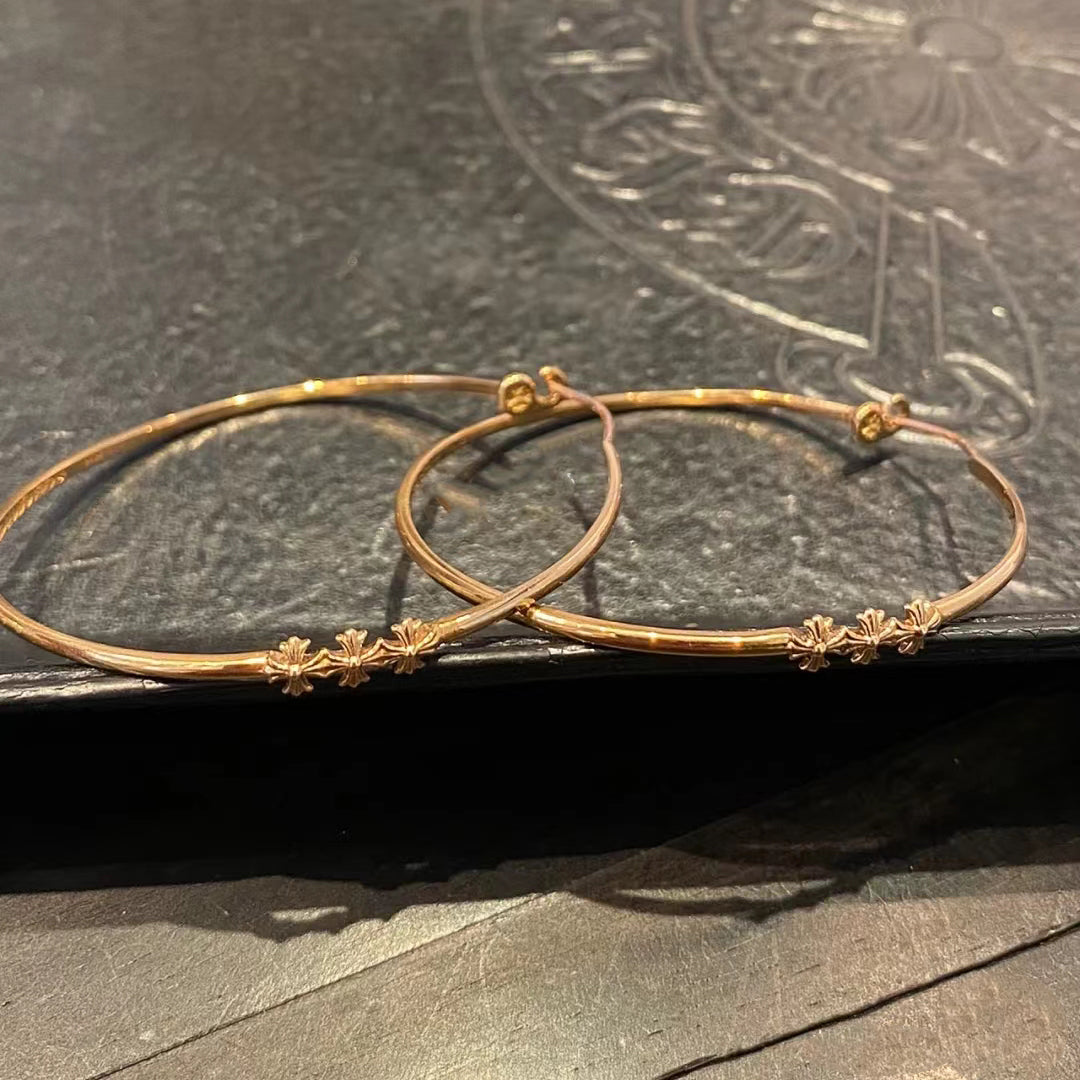 KLX-964244 light gold spear flower cross hoop earrings
