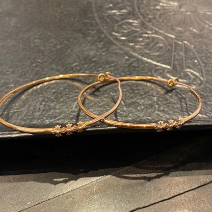 KLX-964244 light gold spear flower cross hoop earrings